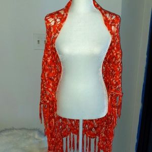 bebe, women's orange shaw with tassel details.